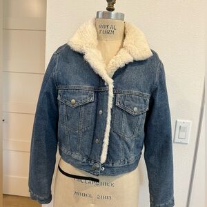 Denim jacket with fur. Side pockets. Fully fur lined.